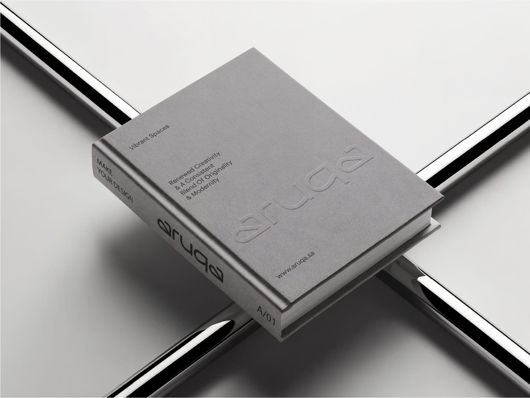 Aruqa — the continuous-line logotype on sand